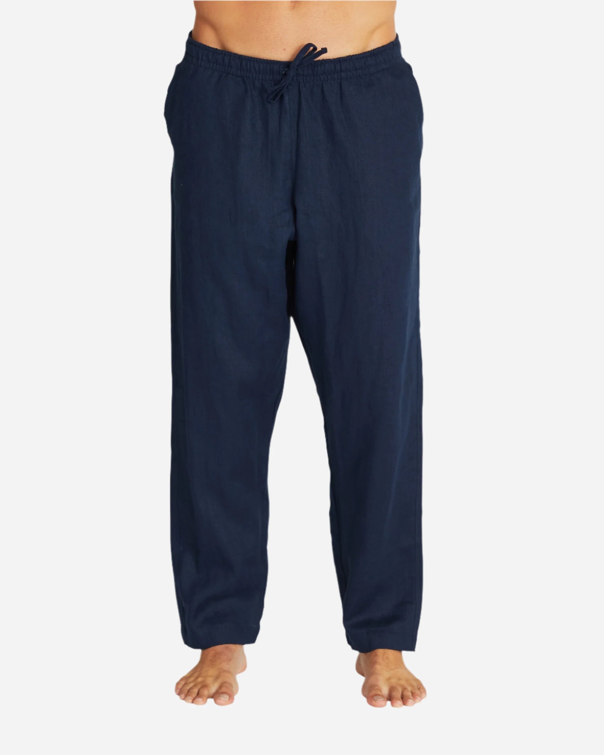 This is a loose fitted navy color linen pants of Okanui and is worn by a model.