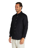 Closer view of the side of Okanui Autumn Linen long sleeve shirt in black.