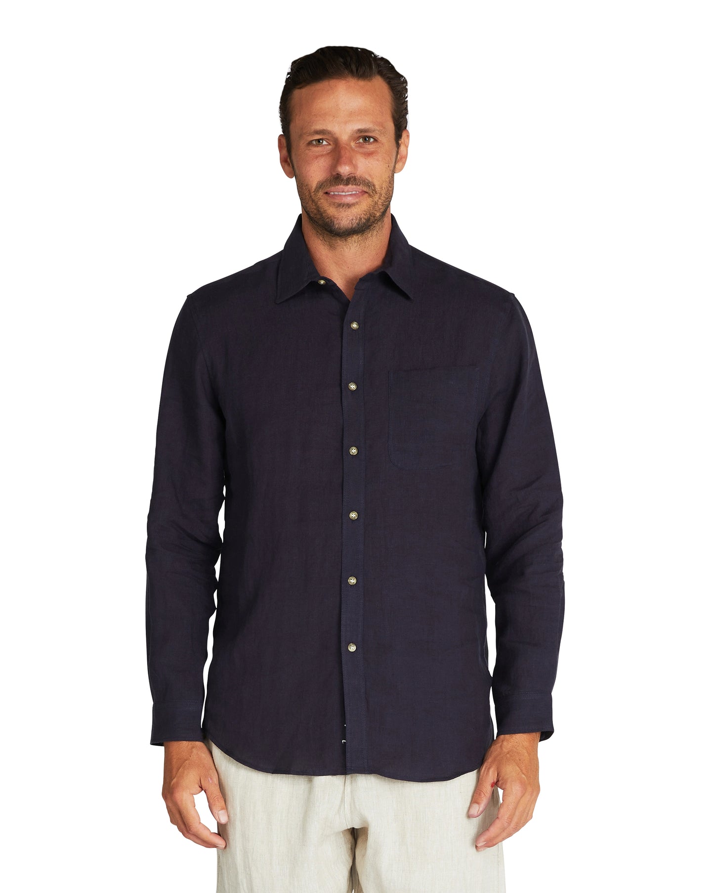 Male model wearing Okanui's linen long sleeve shirt in navy colour.