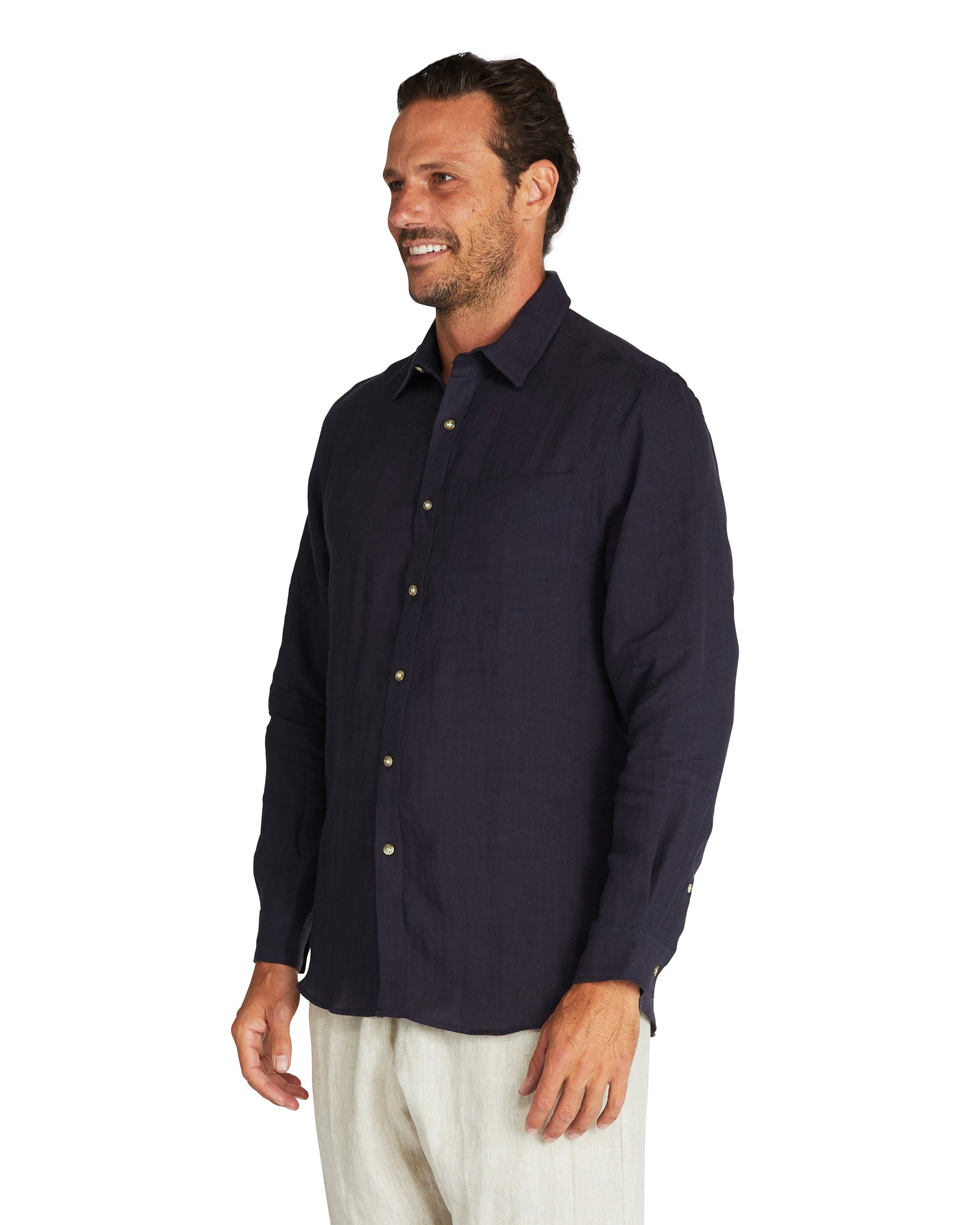 Closer view of the side of Okanui Autumn Linen long sleeve shirt in navy.