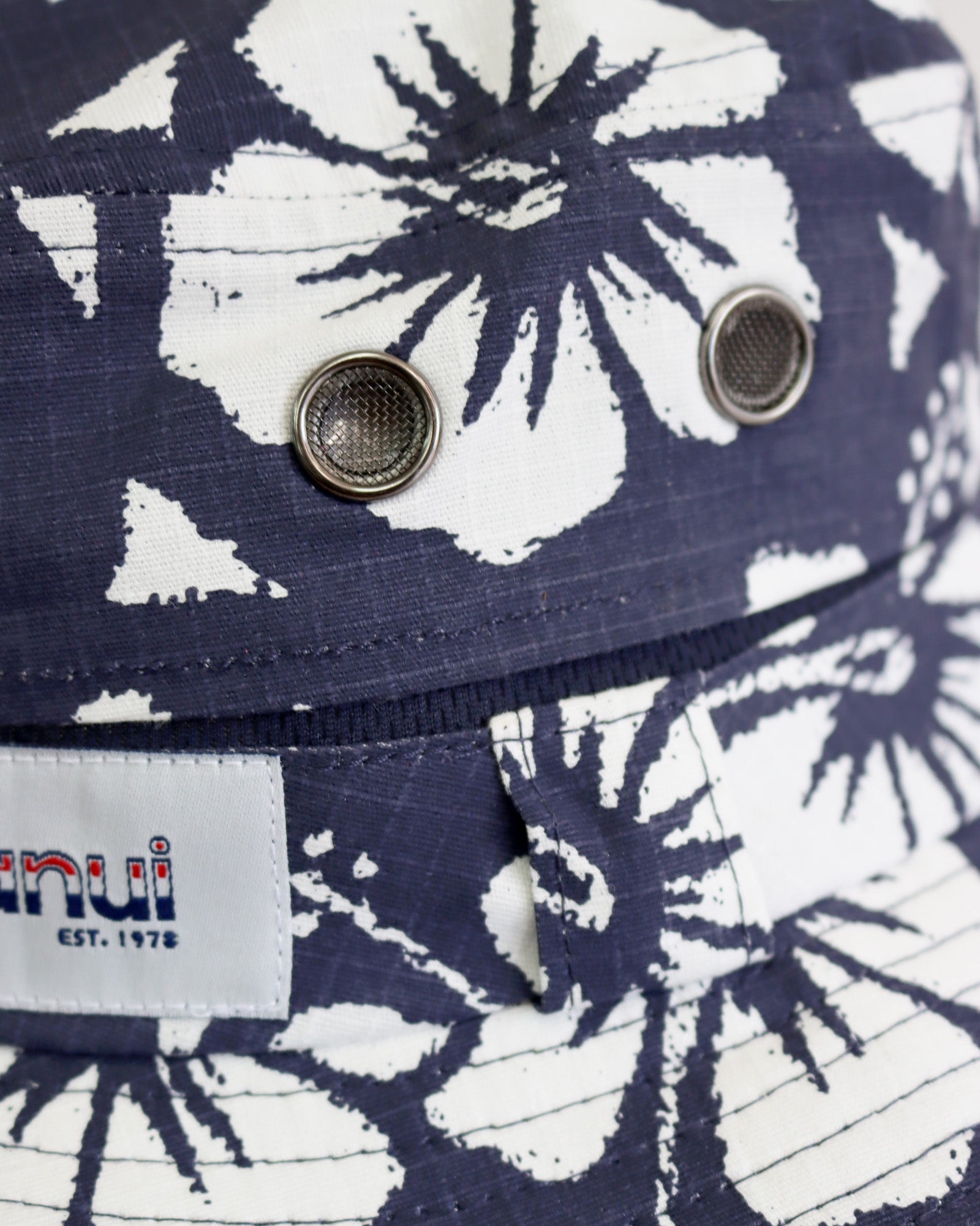 Close up view of the Okanui Classic Boonie Hat in Hibiscus Navy Print