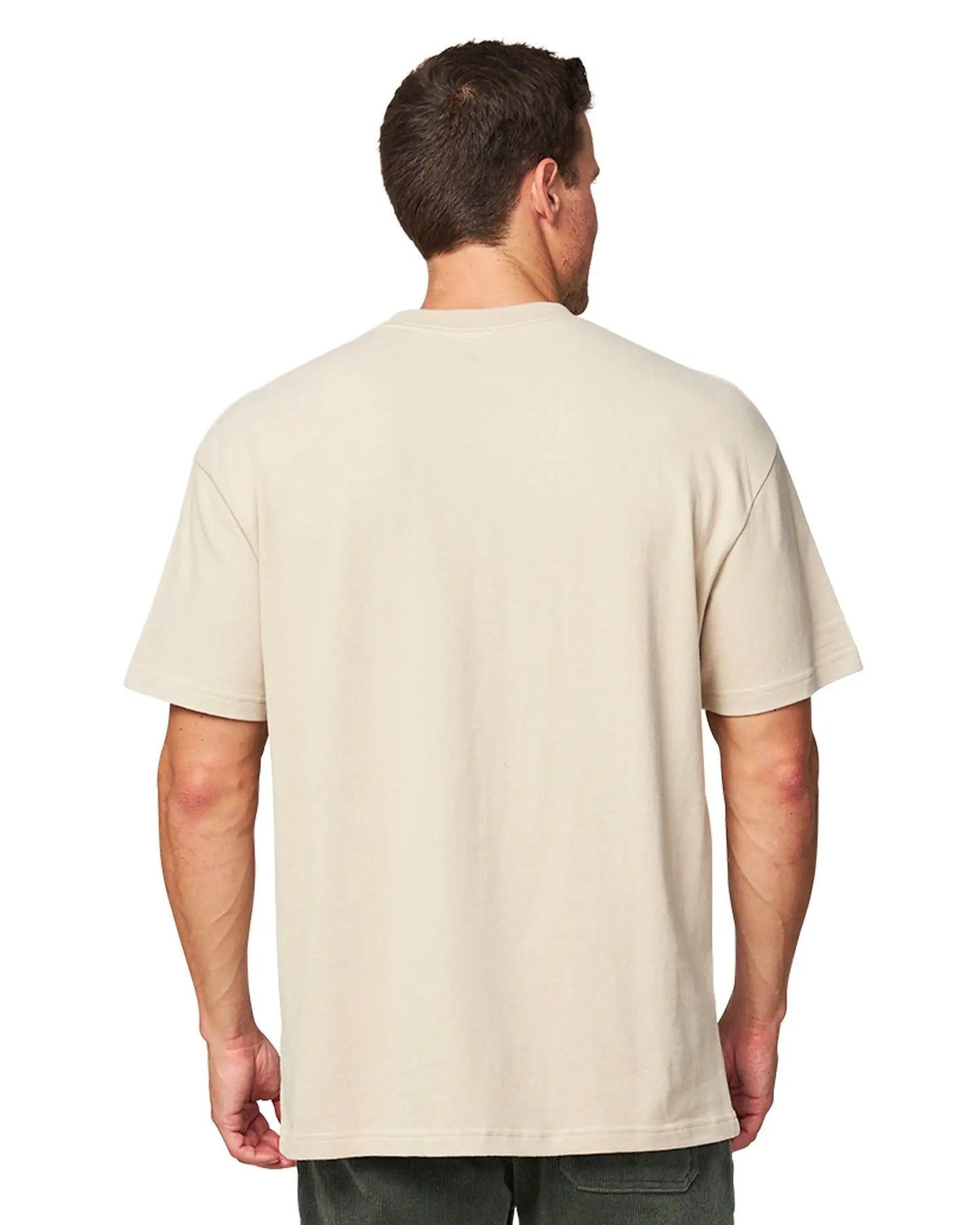 Back view of a male model wearing the Okanui T-shirt Cubist Tee in Washed Stone