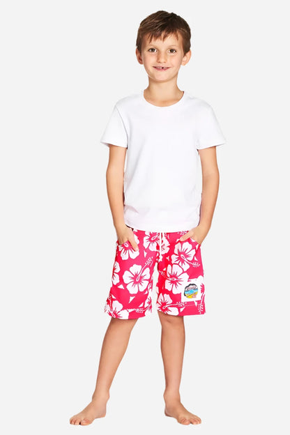 A classic kids white and pink color hibiscus flower short worn with a simple white top shirt