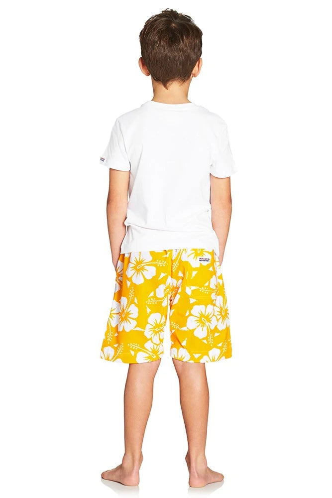 A classic kid short with yellow and white hibiscus flower showing the back part pockets. 