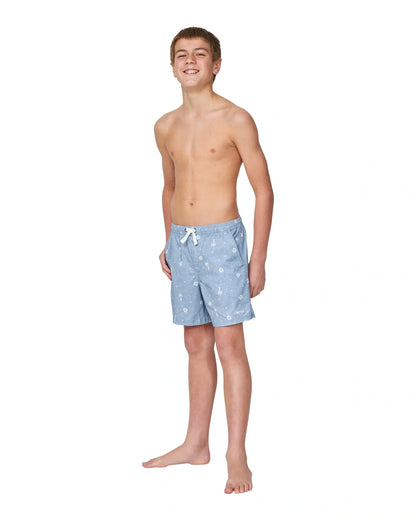 Front view of a topless boy wearing the Okanui walk shorts for boys in washed denim