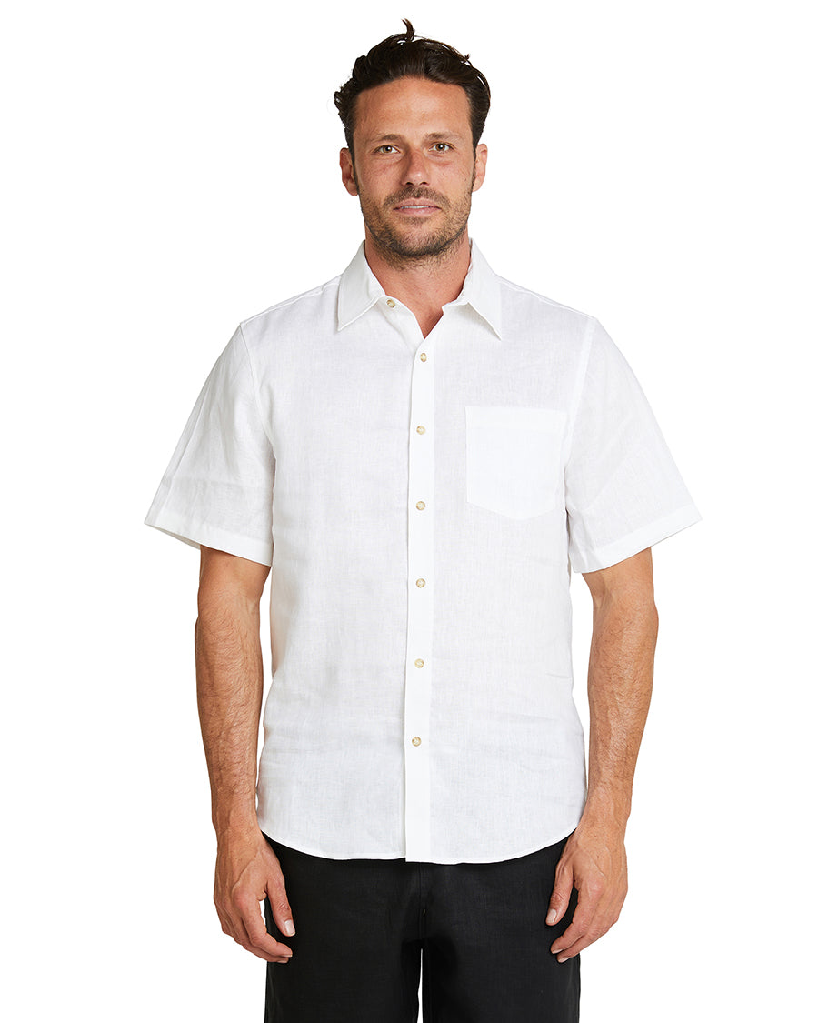 A male model wearing the Okanui Linen Short Sleeve shirt in white colour.