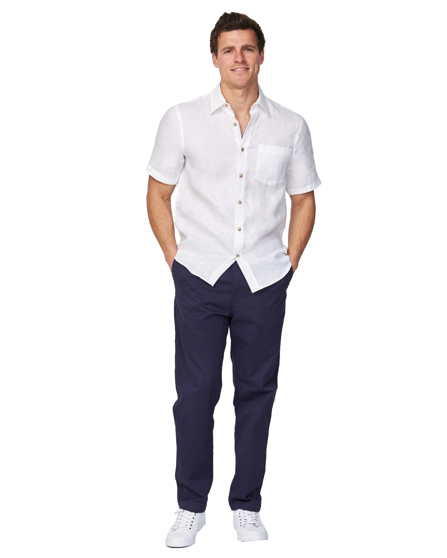 A full body view of the Okanui Wilson Chino Pants in navy worn by a model with shirt and shoes.