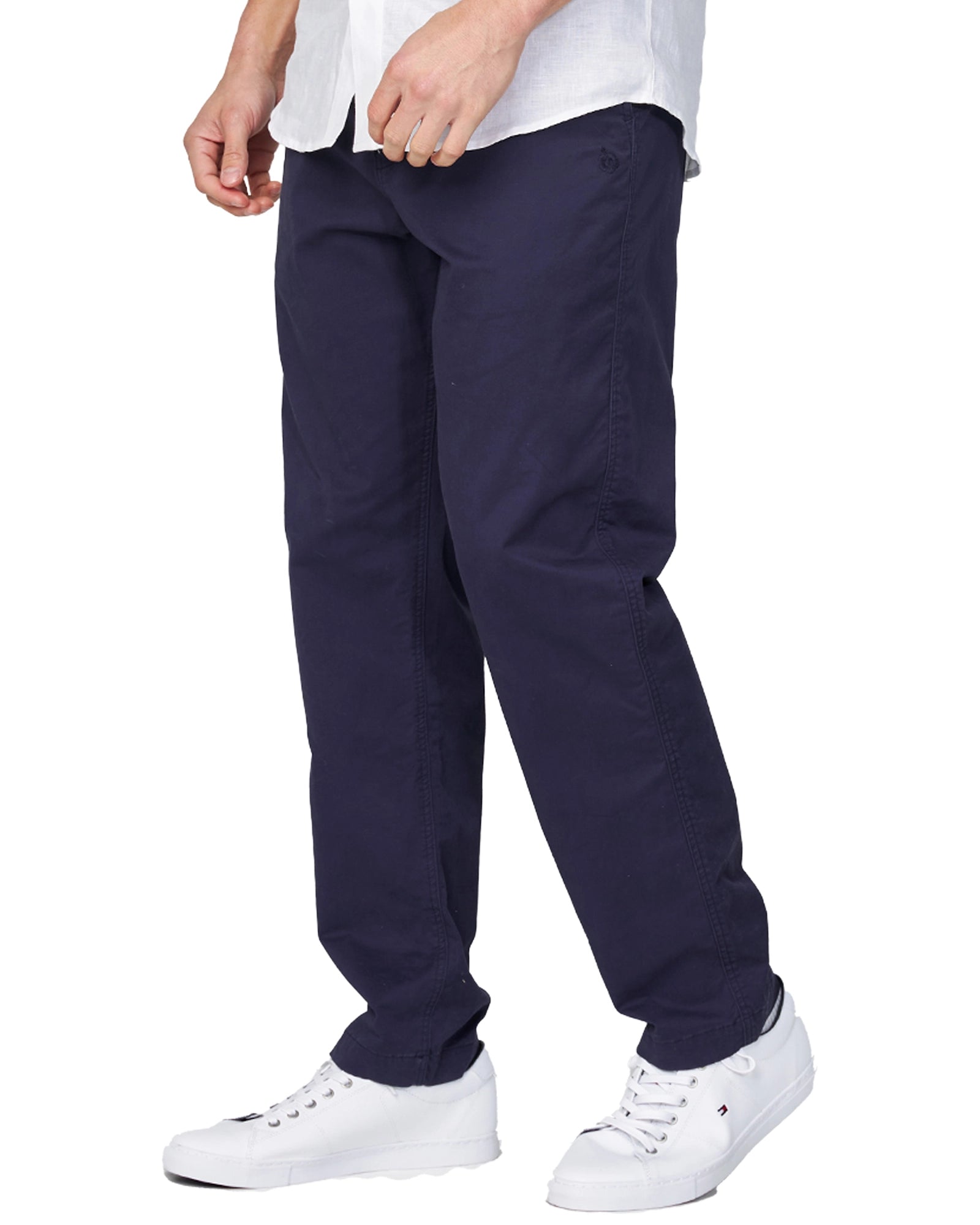 The Okanui Wilson Chino Pants in navy colour as worn with a shirt and shoes.