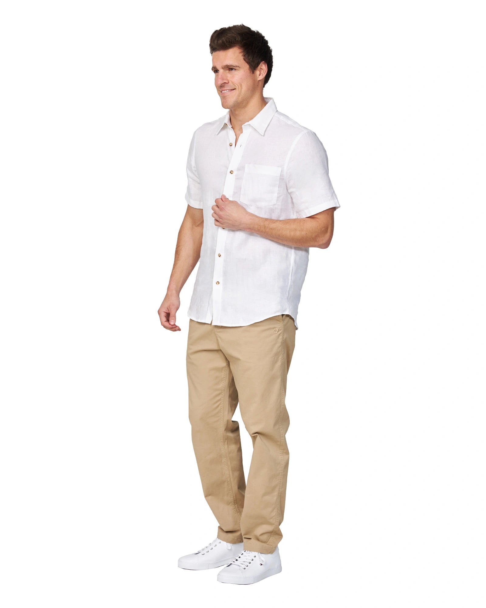 Full-body side view of the Okanui Men's Chino Pants in sand color worn by a model with shirt and shoes.