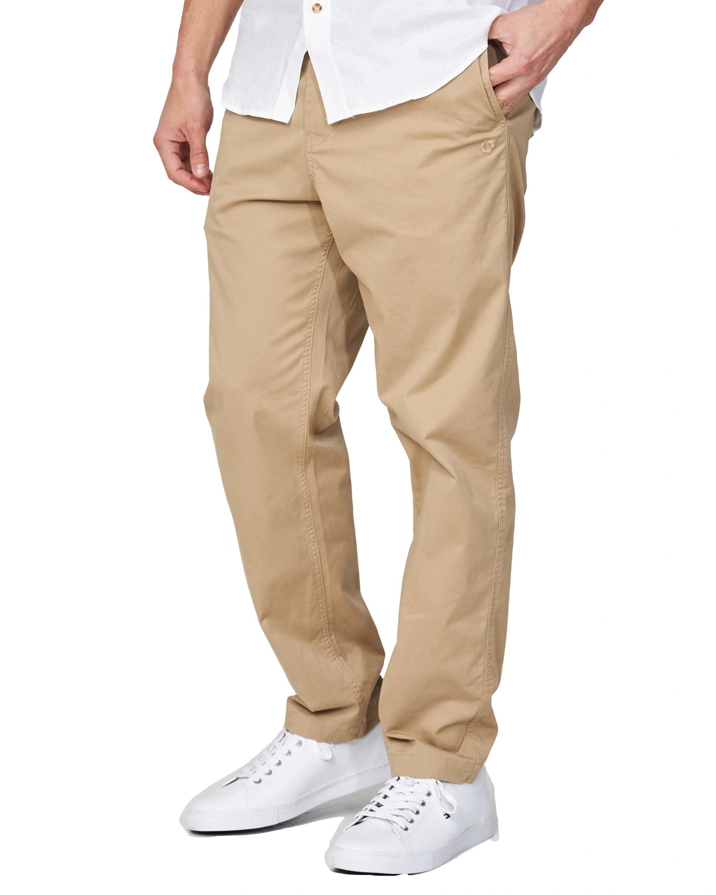 Half-body view of the Okanui Men's Chino Pants in sand color worn by a model with shirt and shoes.