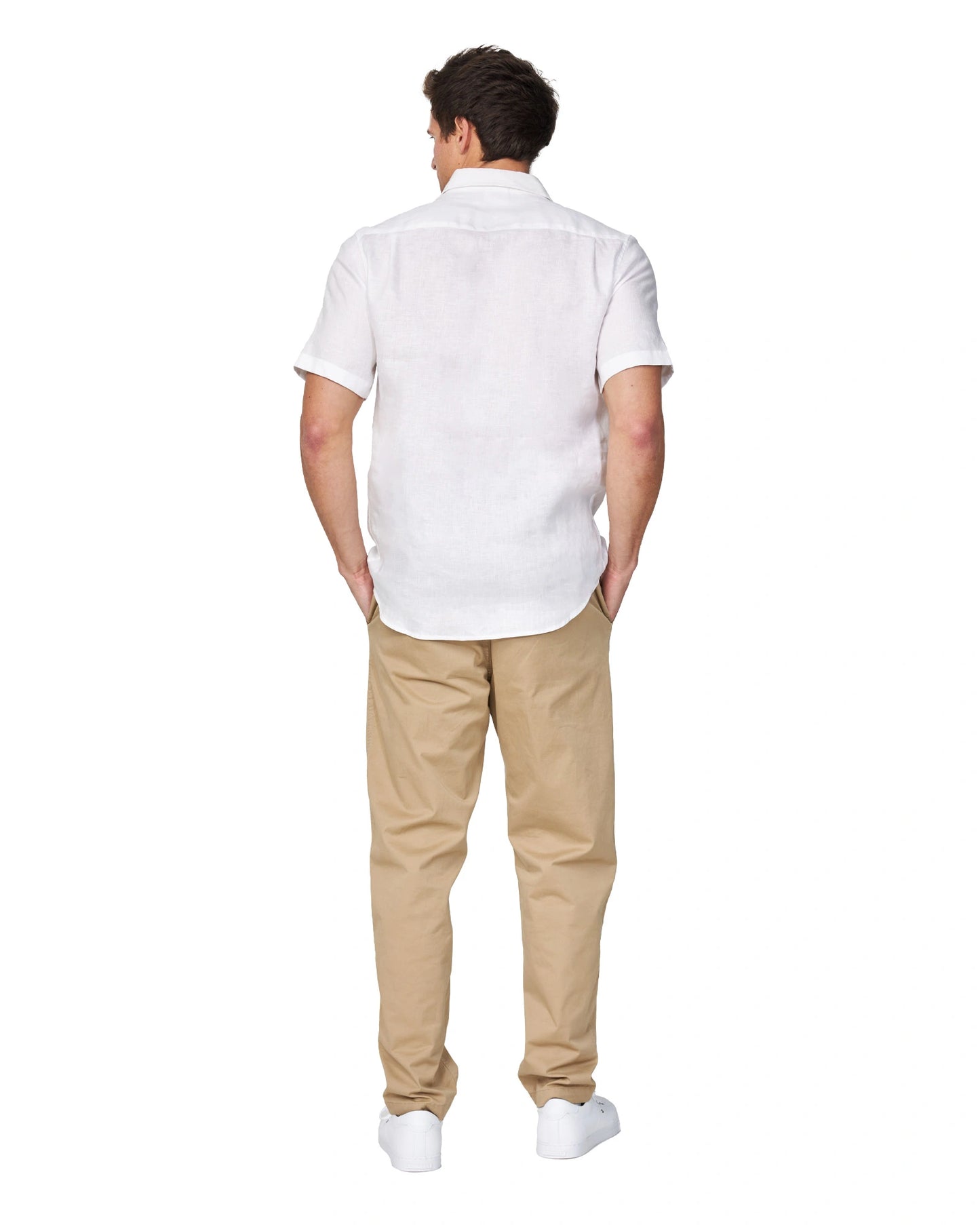 Full-body back view of the Okanui Men's Chino Pants in sand color worn by a model with shirt and shoes.