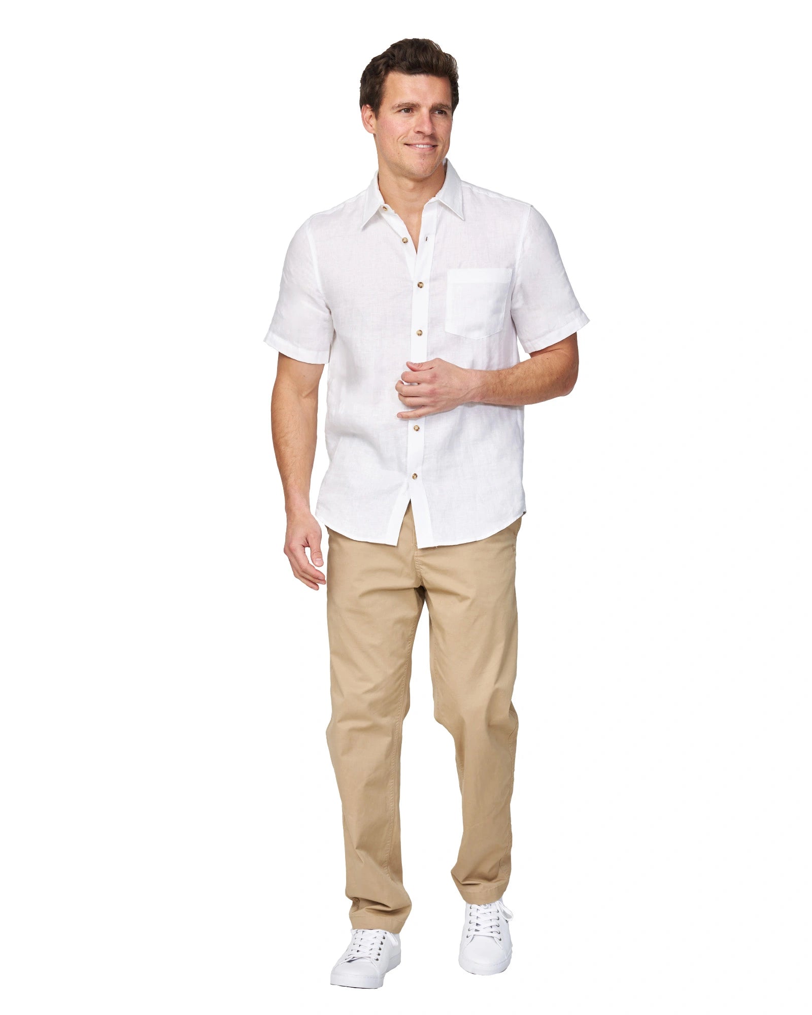 Full-body view of the Okanui Men's Chino Pants in sand color worn by a model with shirt and shoes.