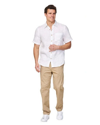 Full-body view of the Okanui Men's Chino Pants in sand color worn by a model with shirt and shoes.