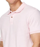 A closer view of the Okanui Classic Polo Shirt in pale pink color featuring a small Hibiscus logo on the left chest.