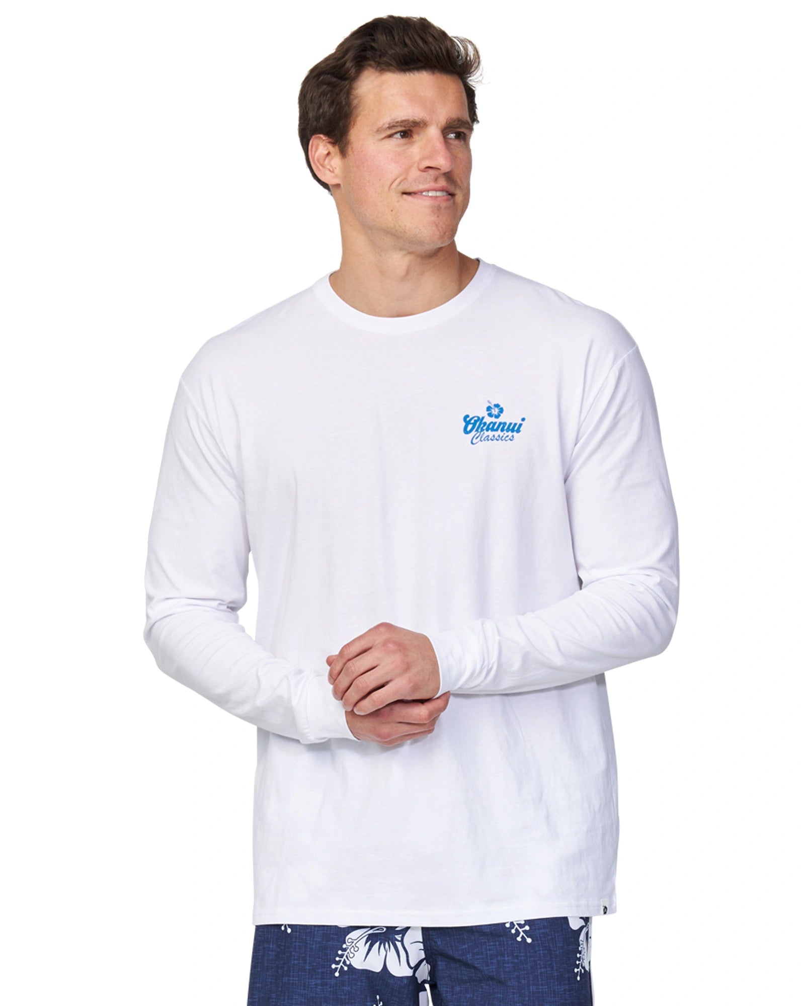 A male model standing in a profile pose wearing the Okanui Fast Lane Long Sleeve T-shirt in white color.