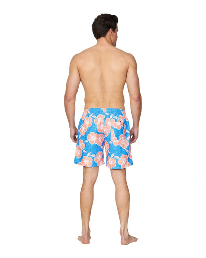 A full body back view of a male model wearing the Okanui Way Back When Swimshorts in Bright Blue/Orange Colour.
