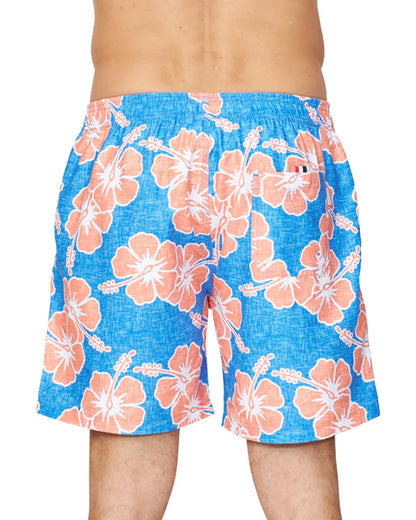 A lower back view of a male model wearing the Okanui Way Back When Swimshorts in Bright Blue/Orange colour emphasizing the elastic waist and single back pocket.