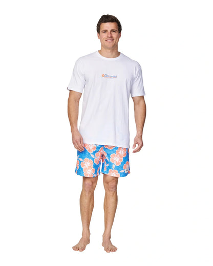 The Okanui Way Back When Swimshorts in Bright Blue/Orange colour paired with a white t-shirt.