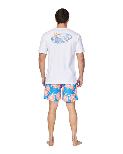 Back view of the Okanui Way Back When Swimshorts in Bright Blue/Orange colour paired with a white t-shirt with a print on the back.