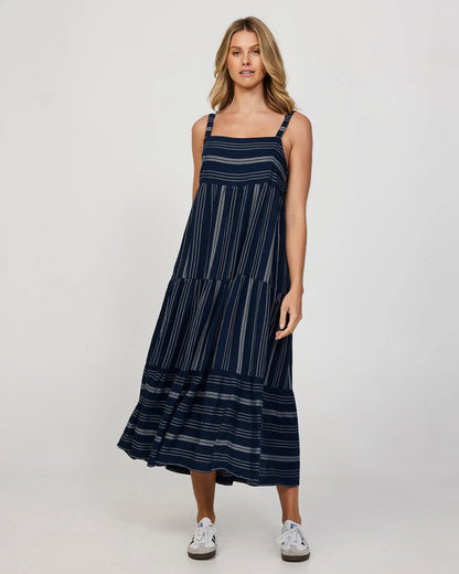 Full front view of a female model wearing a long navy Okanui Dress.