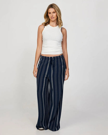 Full front view of the Okanui women's beach pants in navy color.