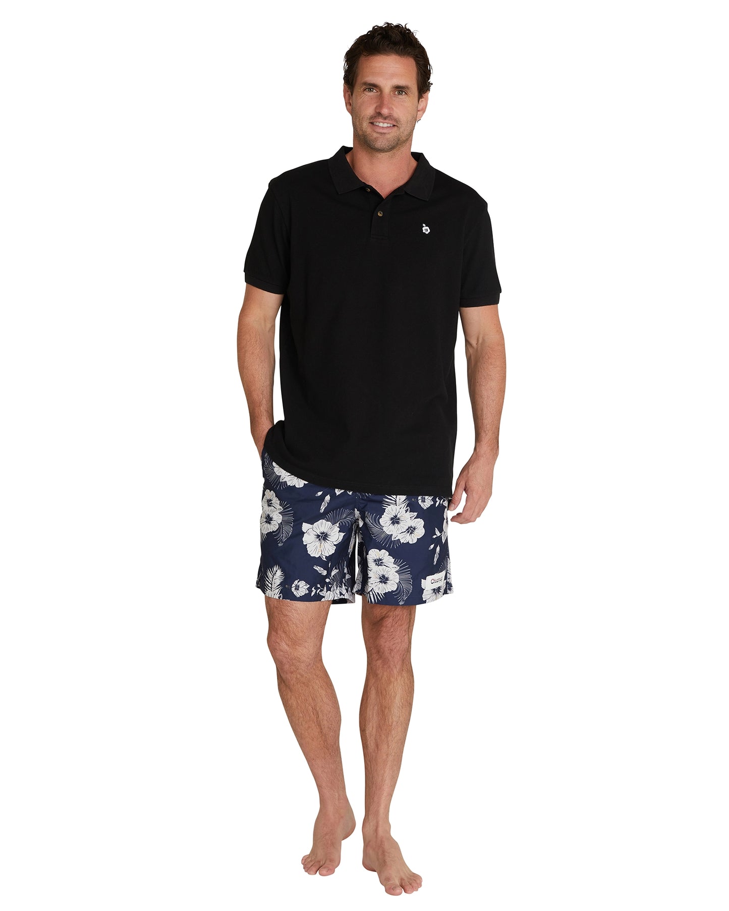 Full body view of a model wearing the Okanui Classic Polo Shirt in black colour.