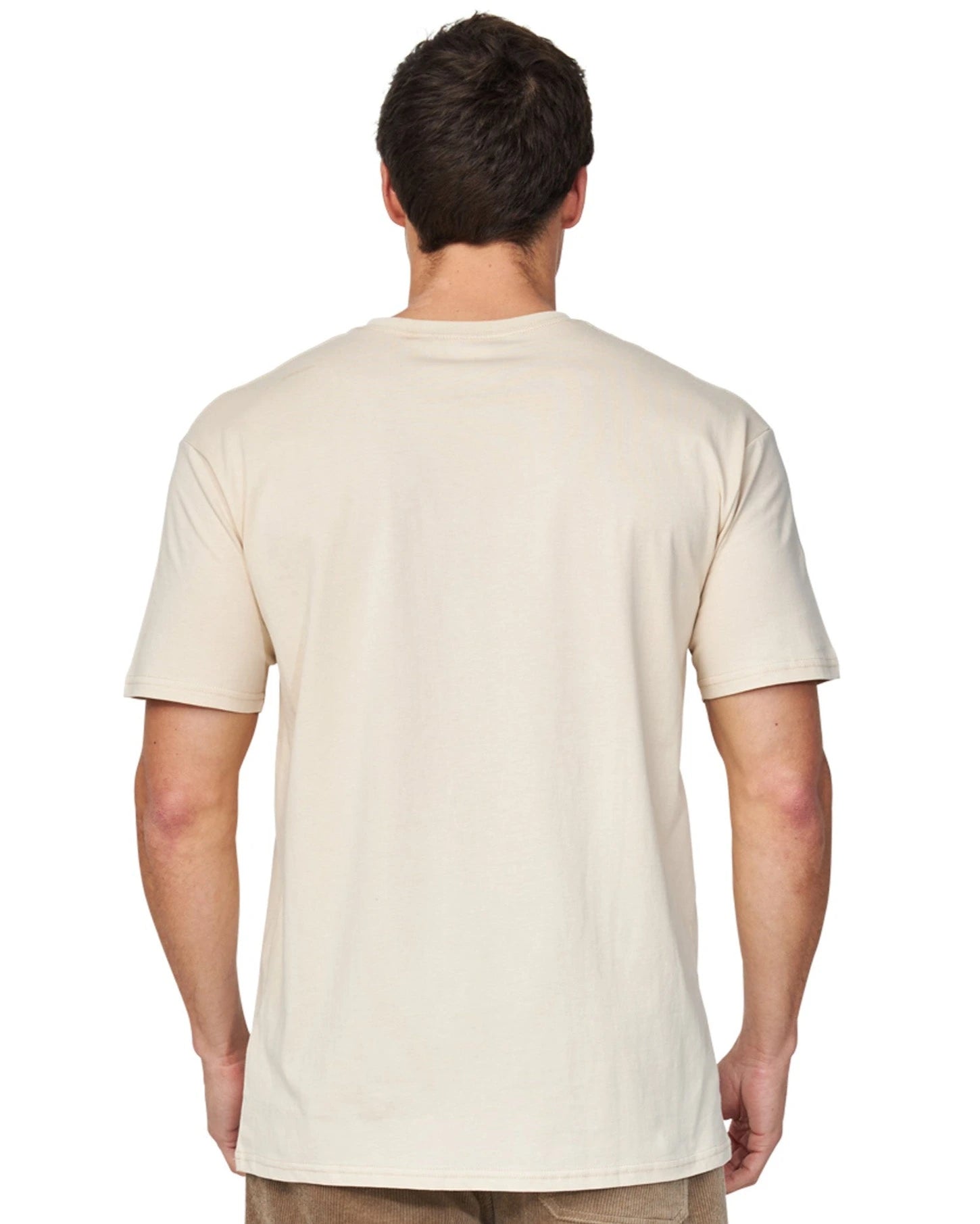 A closer back view of a male model wearing the Okanui Staple Tee in Birch color.