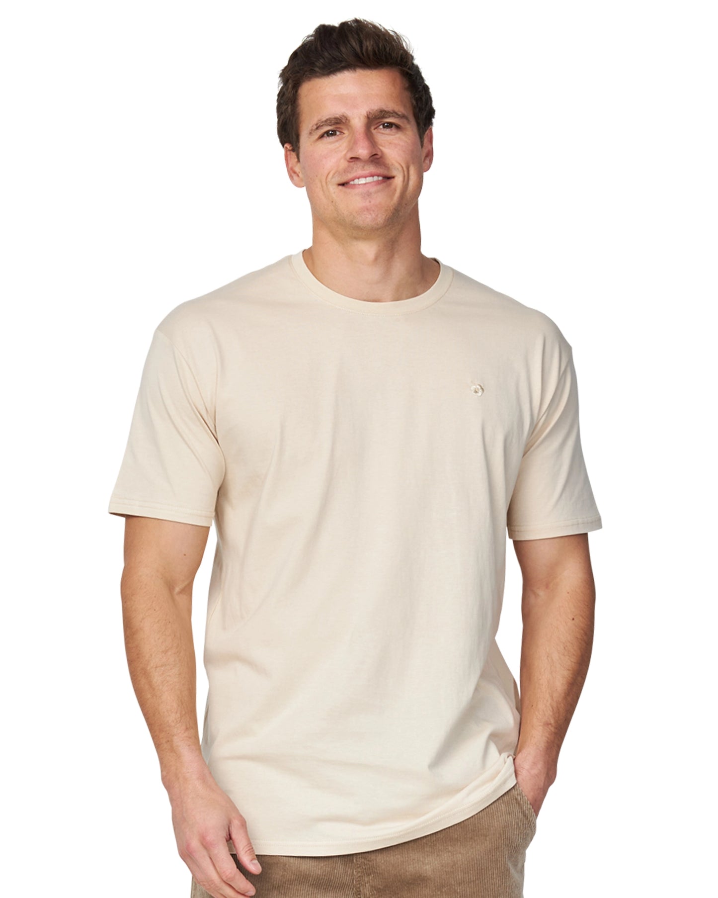 A male model wearing the Okanui Staple Tee in Birch color.