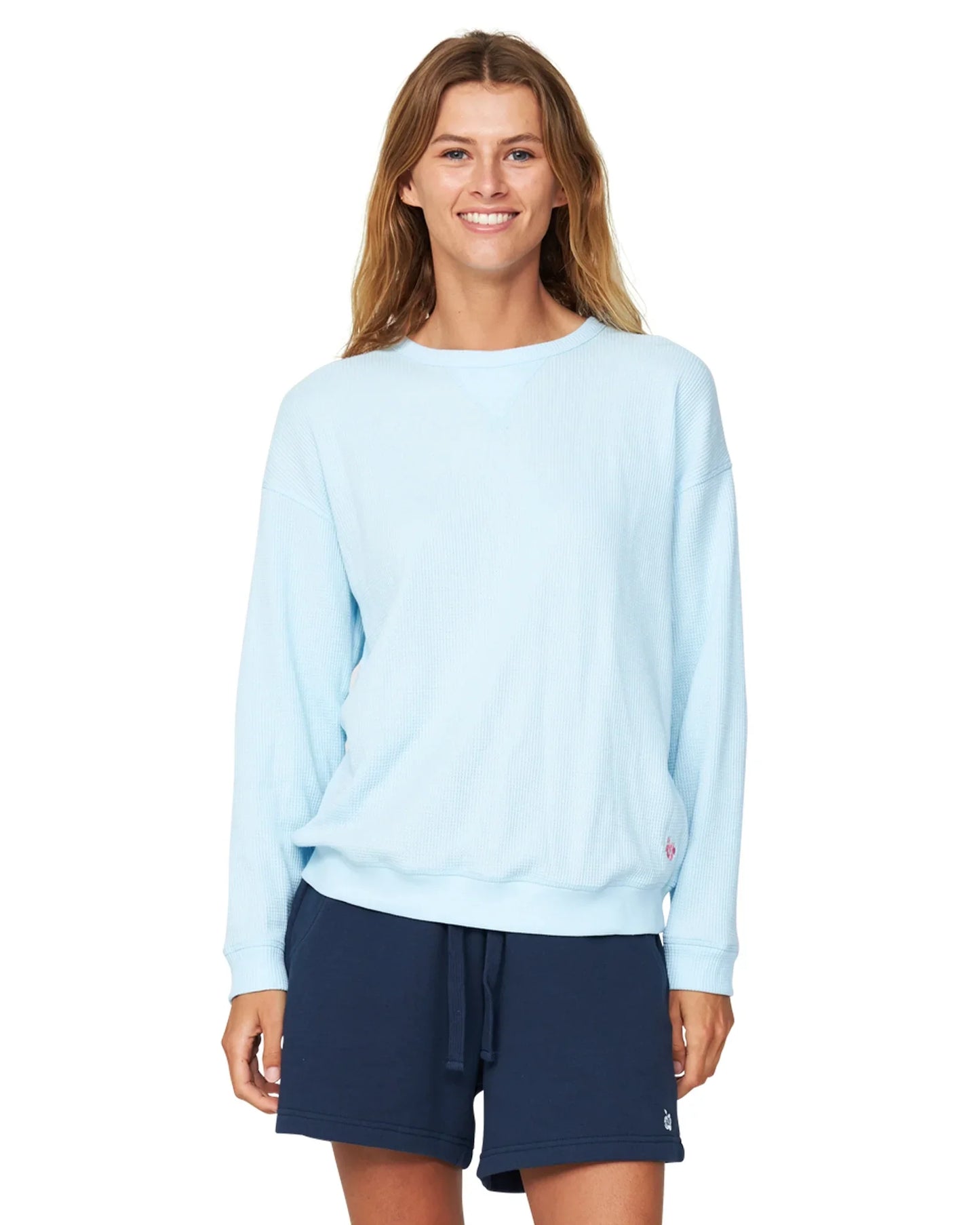 Women's blue top and navy-blue fleece shorts.