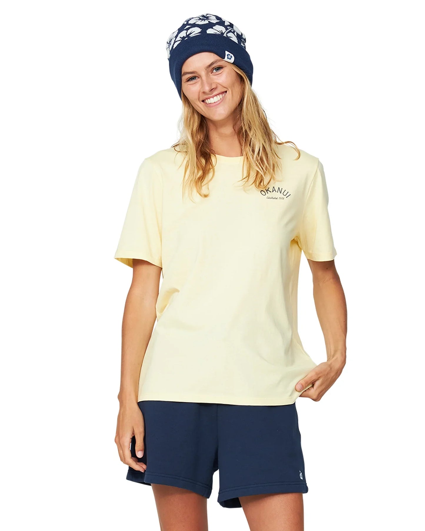 Women's navy blue fleece shorts paired with a yellow shirt and a navy blue bonnet.