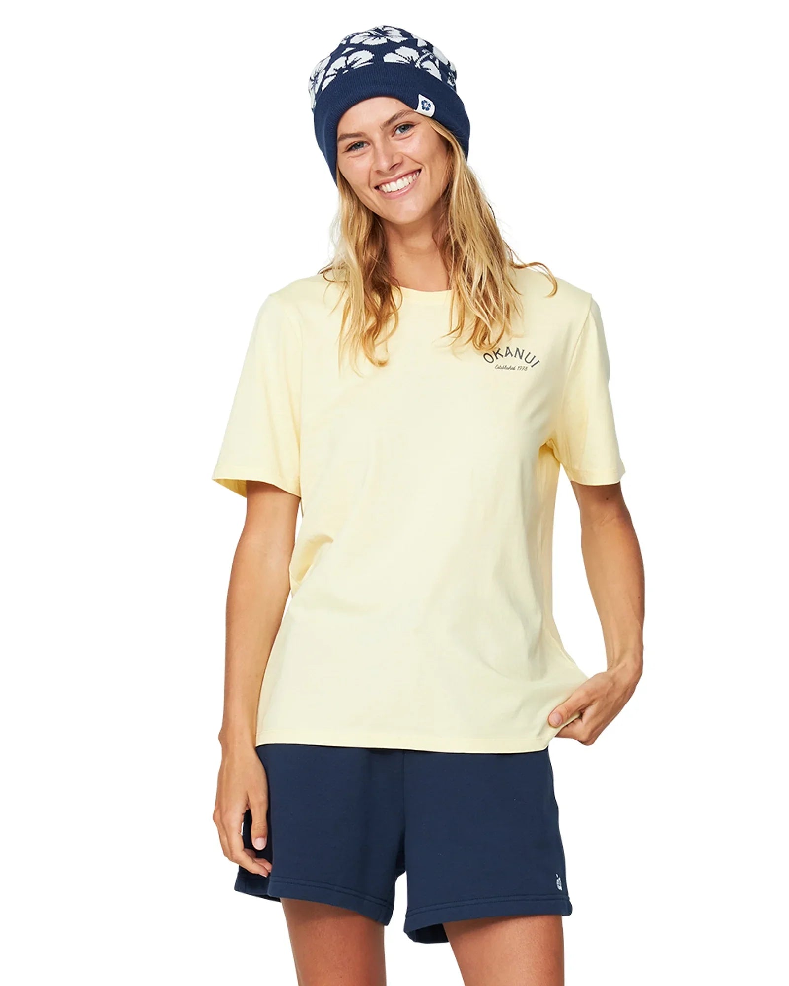 Women's navy blue fleece shorts paired with a yellow shirt and a navy blue bonnet.