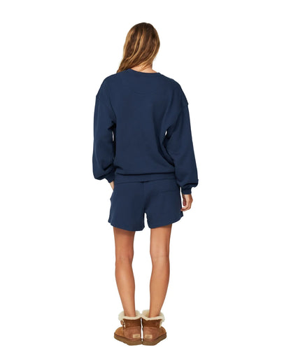 Womens winter fleece with navy blue-colored short showing the back part.