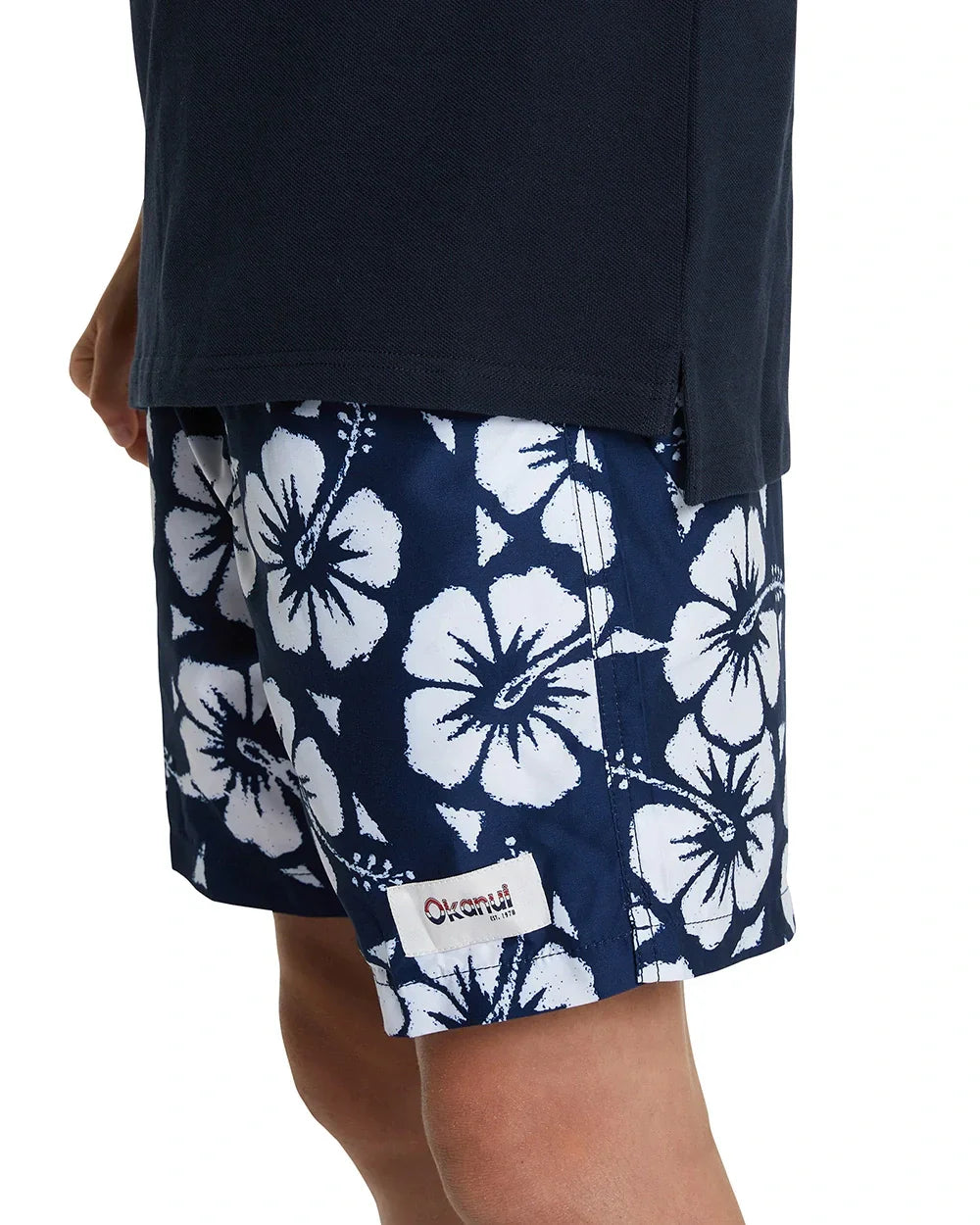 Close up photo of the Okanui classic polo shirt in Navy, crafted from 100% premium cotton in a stepped hemline cut