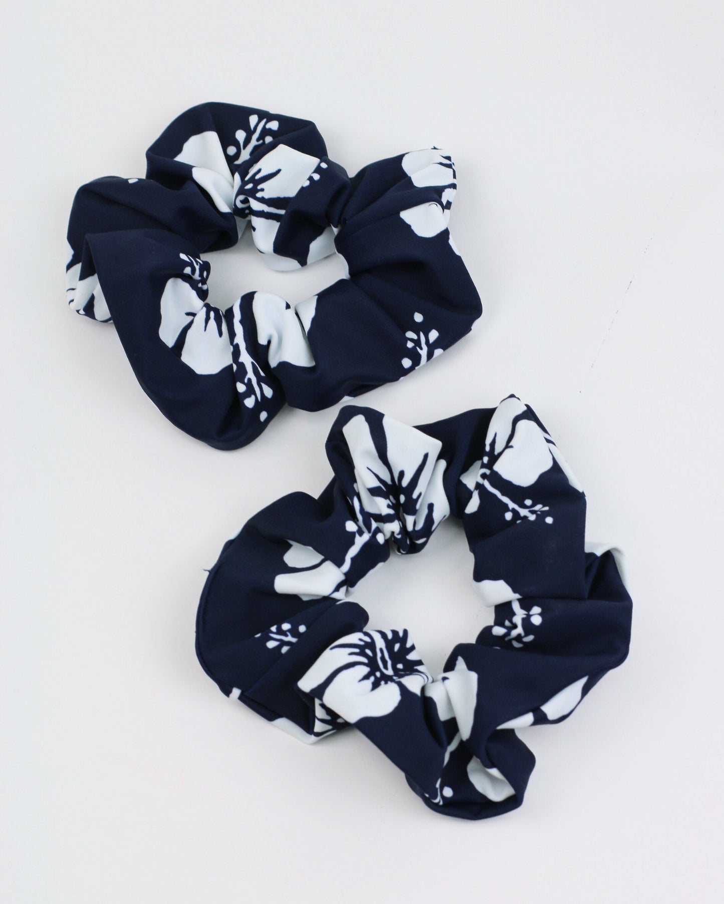 side to side photo of the Okanui hair scrunchie in navy white