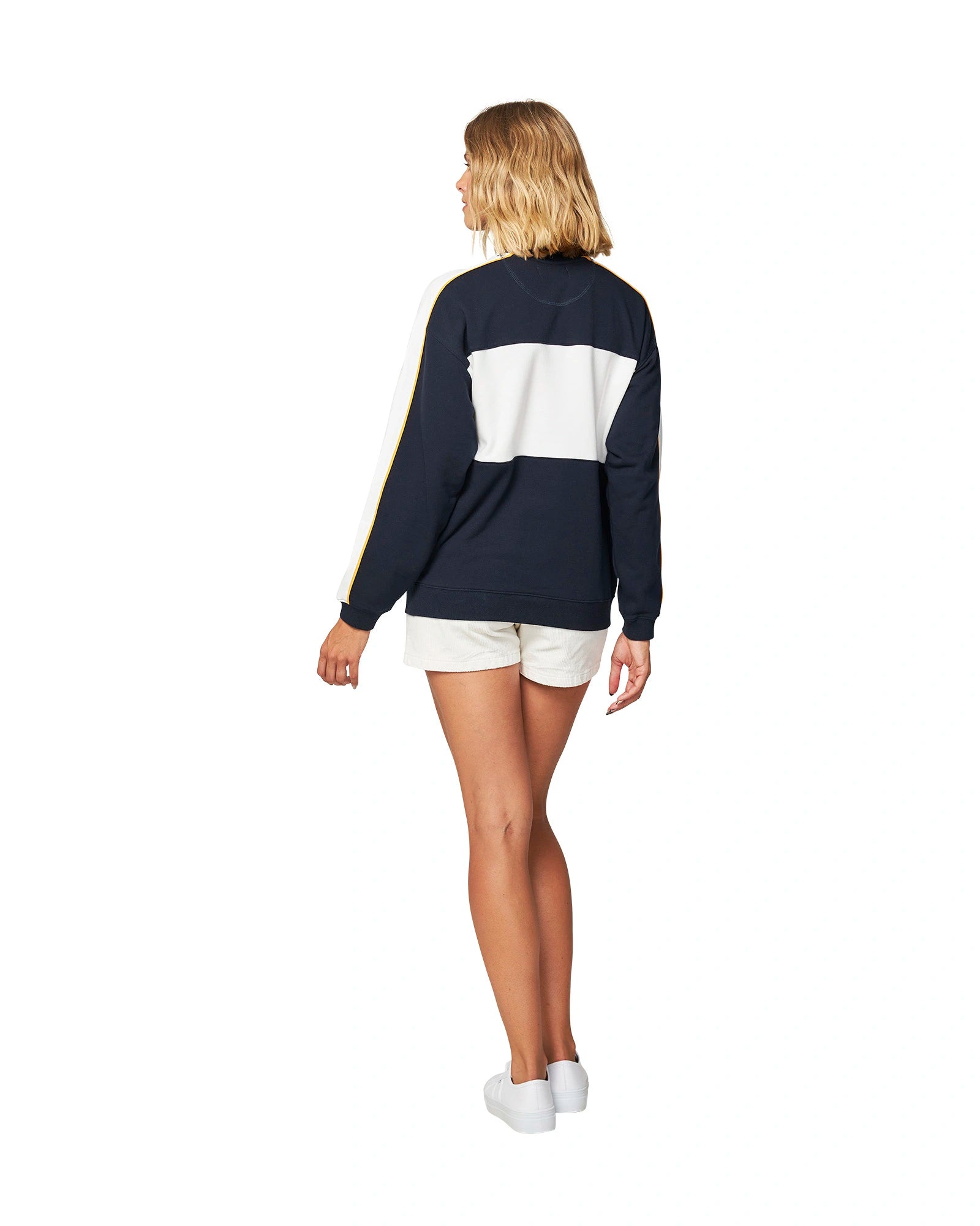 Okanui Womens varsity sweater in white and navy blue color showing the back view. 