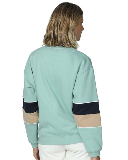 A womens winter sweater in color sage showing the back part. 