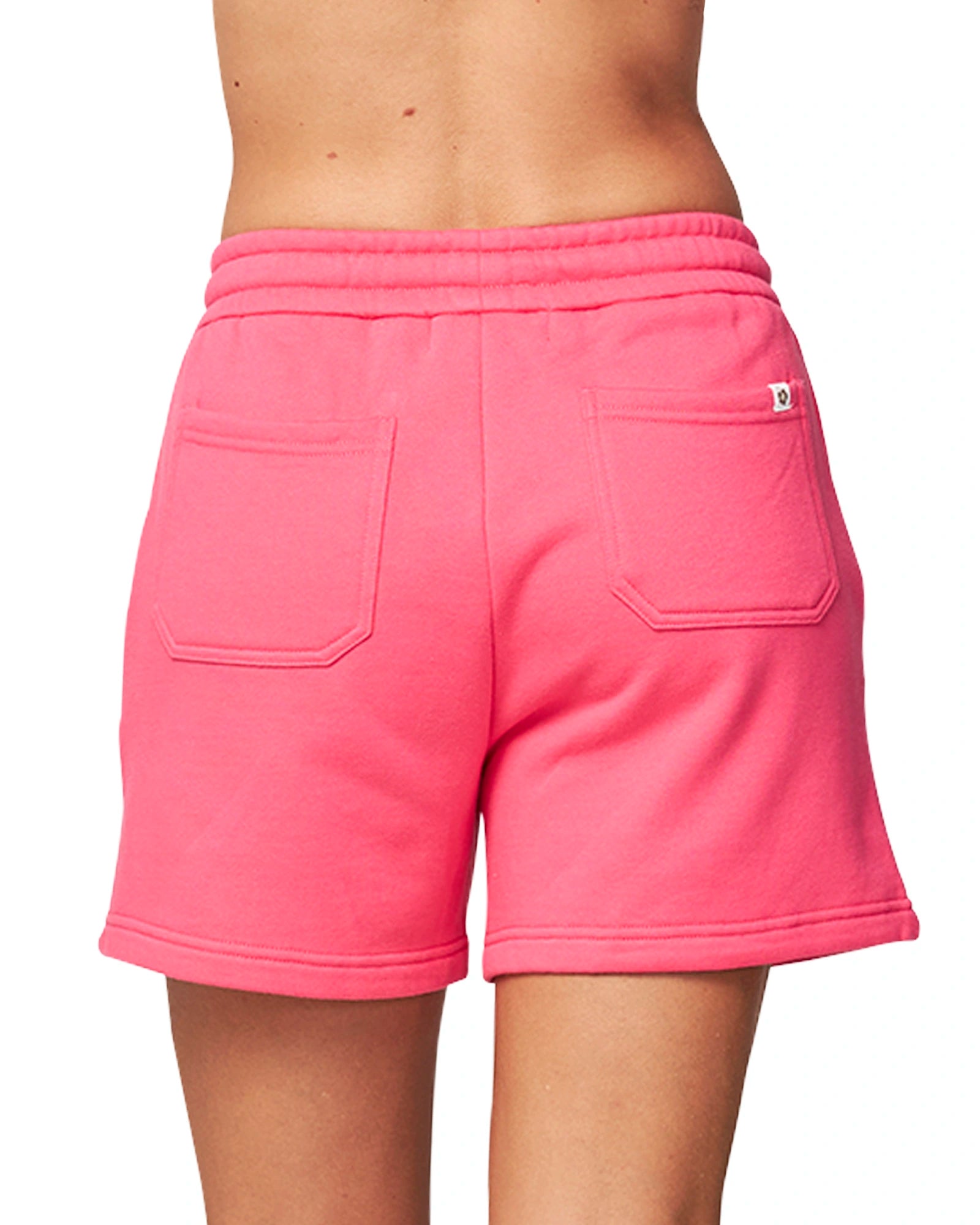 A women's autumn fleece short in hot pink color showing the two pocket. 