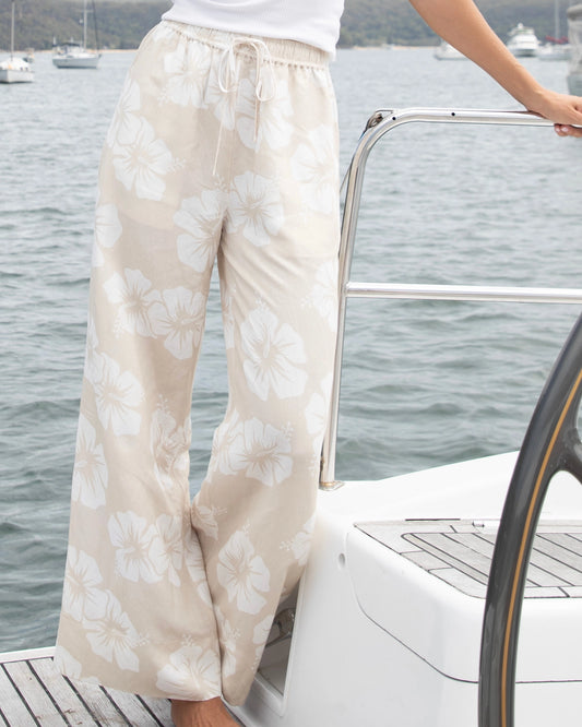 Front view of the Okanui wide leg beach pants in Hibiscus Natural variant