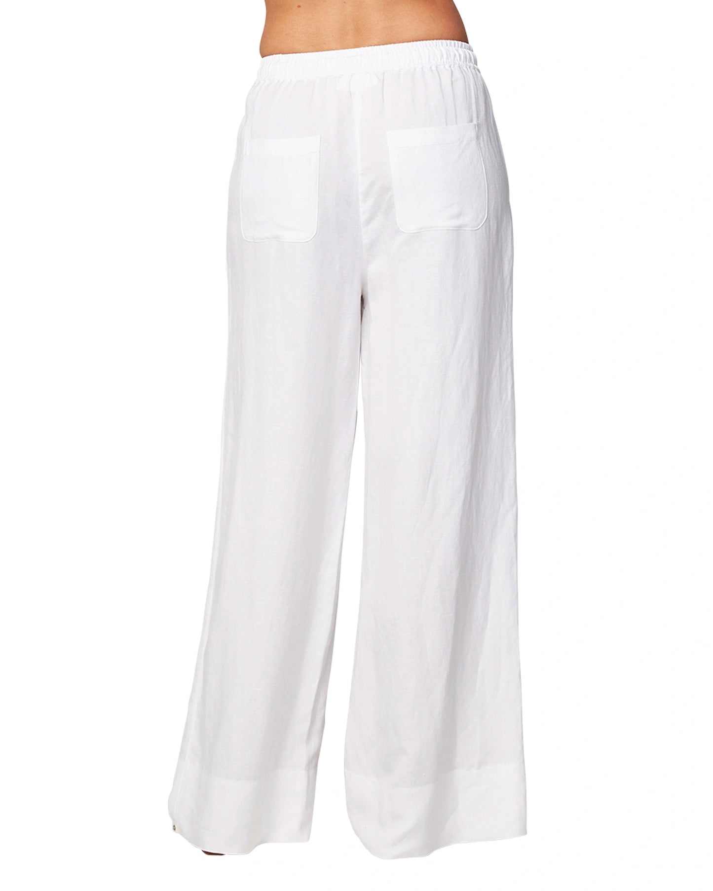 Back view of the Okanui wide leg linen beach pants in white color