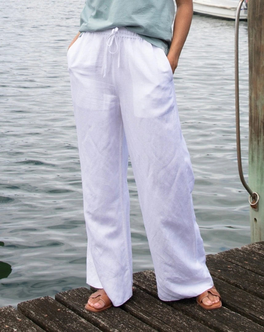 Close up view of the Okanui wide leg linen beach pants in White color