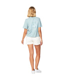 Full body back view of a female model wearing the Okanui Tour Cropped cotton T-shirt in Sage variant