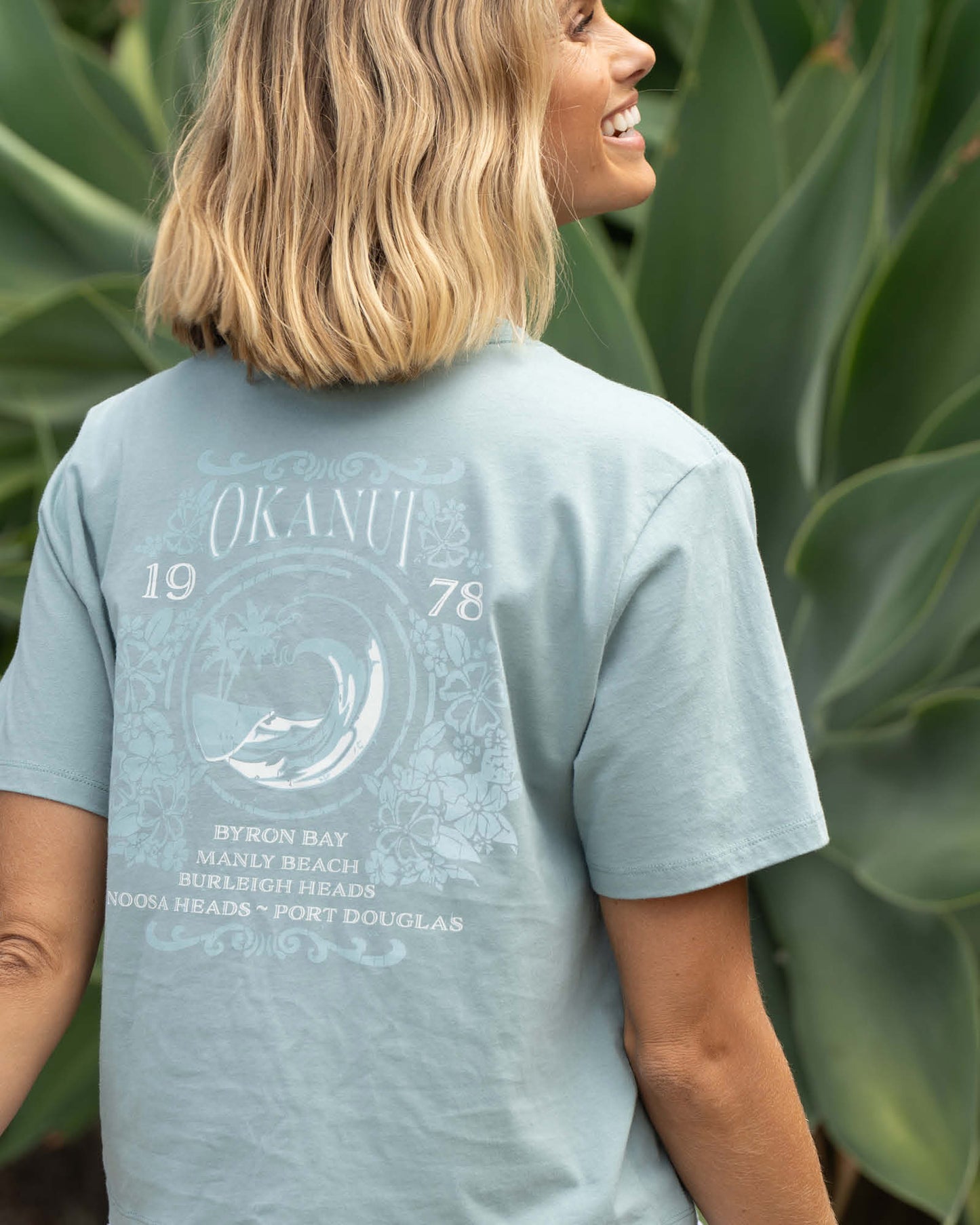 Close up back view of the womens Okanui Tour Cropped cotton T-shirt in Sage variant