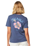 Close up back view of a female model wearing the Okanui Ikon cotton T-shirt in Washed Navy color