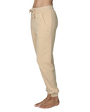 Left angled view of the Okanui jogger track pants in natural color