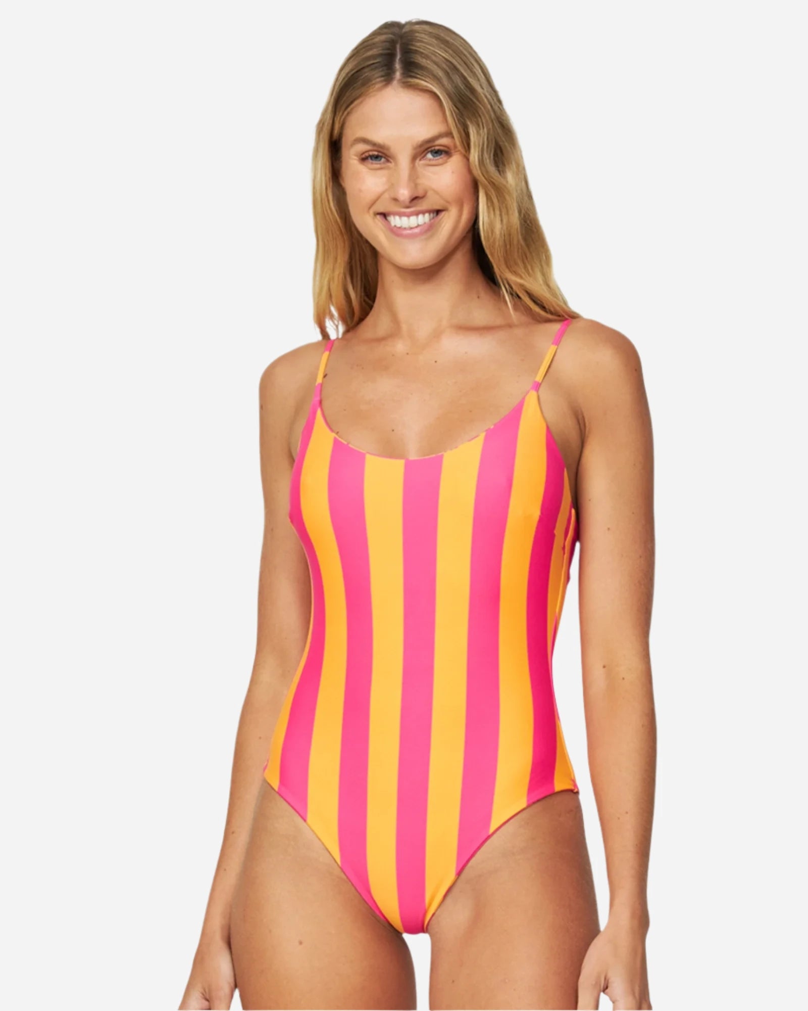 A woman is wearing a one-piece swimsuit with stripes in the color melon pink. 