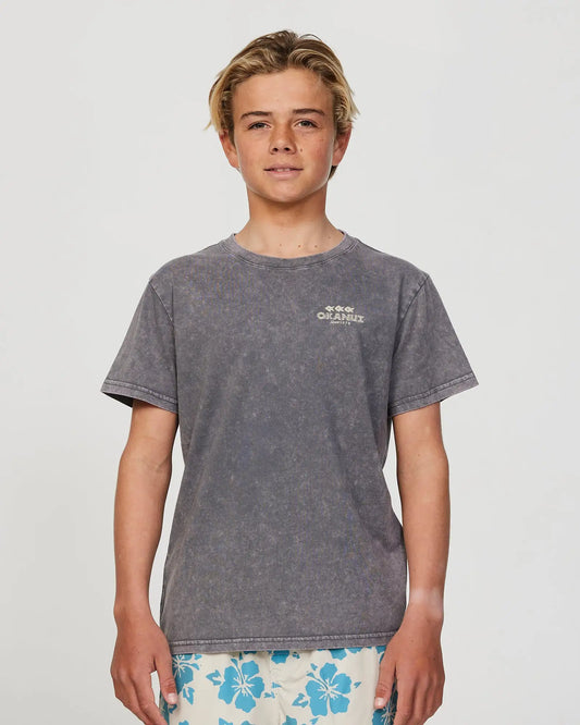 Closeup front view of a boy model wearing the Okanui Cut Paste T-shirt for boys in Washed Black