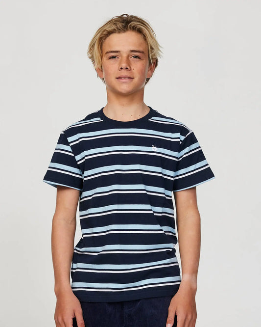 Closeup front view of a boy model wearing the Okanui Staple Stripe T-shirt for boys in Navy Multi