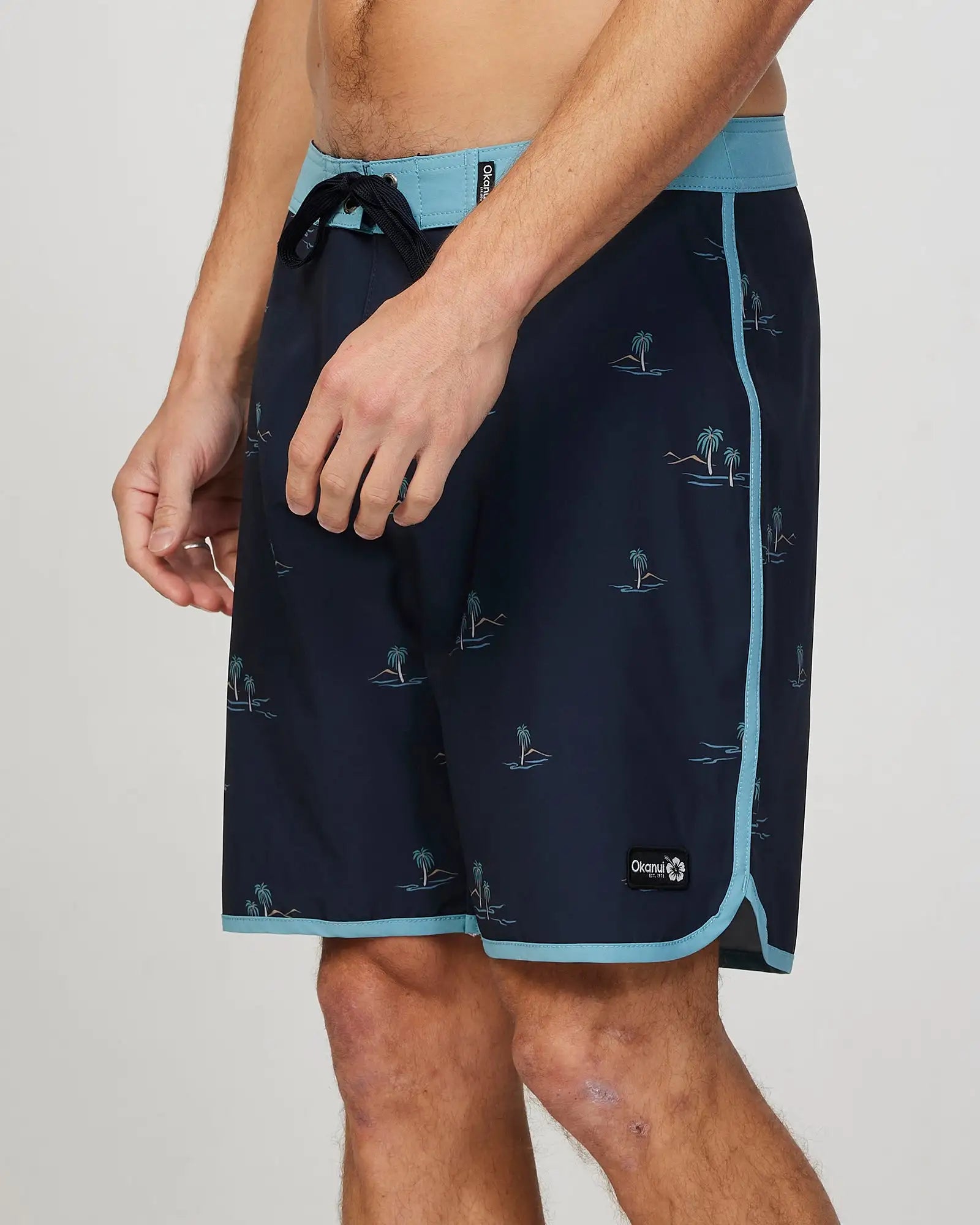 Left side view of the Okanui Mens Isle Retro boardrider board short in Black