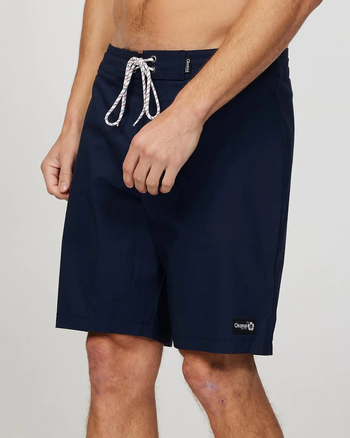 Left side view of the Okanui Mens Rinsed boardrider board short n Navy