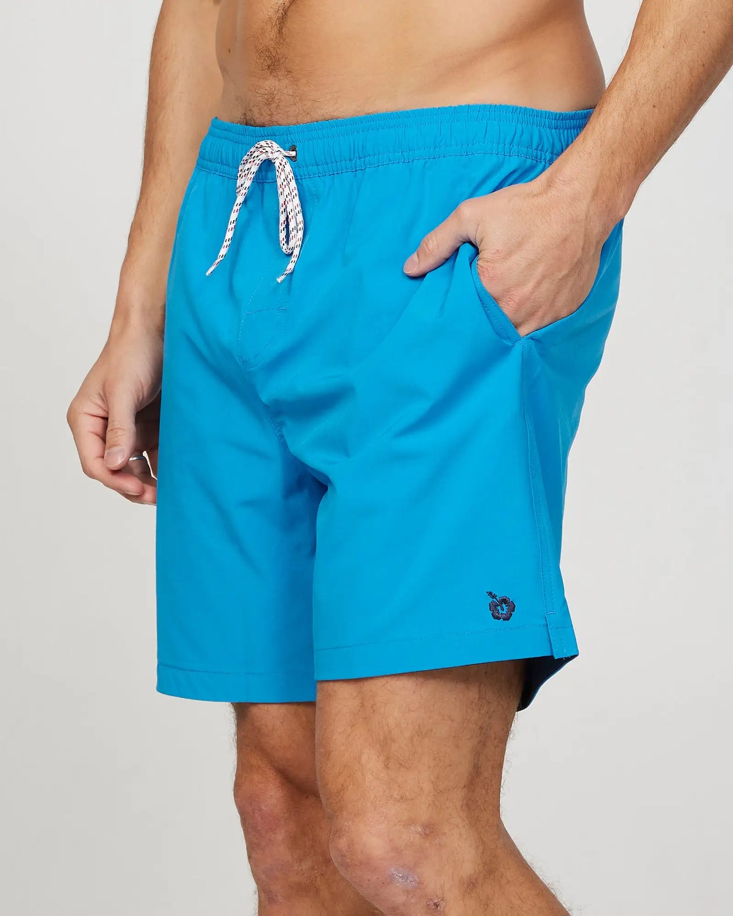 Left side view of the Okanui Mens Onboard stretch swim short in Blue